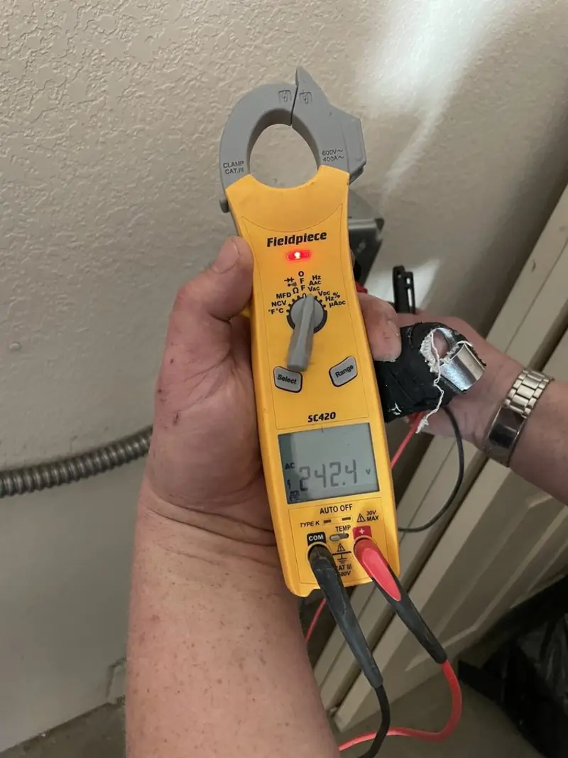 Voltage testing with clamp meter during Outlet Installation in Sudley